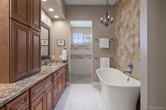 bathroom featuring walk in shower, tile patterned flooring, vanity, recessed lighting, and a freestanding tub