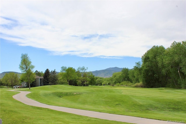 16179 W 70th Pl, Arvada, CO 80007 - surrounding community with a mountain view, view of golf course, and a lawn