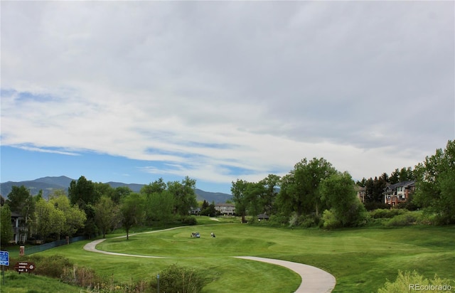 16179 W 70th Pl, Arvada, CO 80007 - surrounding community with a mountain view, a lawn, and golf course view