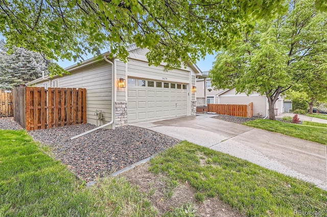 16179 W 70th Pl, Arvada, CO 80007 - garage with driveway and fence