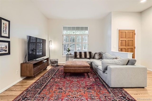 16179 W 70th Pl, Arvada, CO 80007 - living room with light wood-style flooring and baseboards