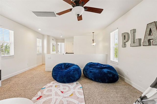 1063 Roslyn Ct, Denver, CO 80230 - playroom with healthy amount of natural light, baseboards, a ceiling fan, carpet, and recessed lighting