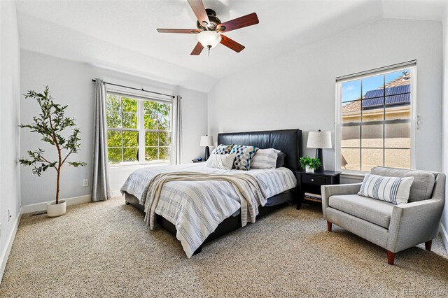 1063 Roslyn Ct, Denver, CO 80230 - bedroom with light carpet, vaulted ceiling, baseboards, and a ceiling fan