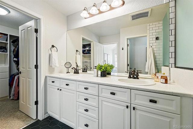 1063 Roslyn Ct, Denver, CO 80230 - full bathroom featuring a spacious closet and double vanity