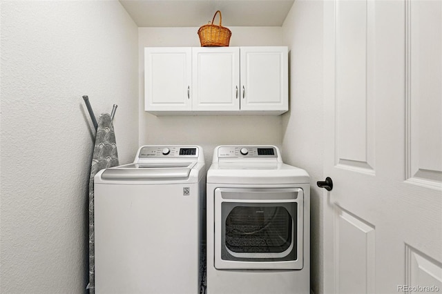 1063 Roslyn Ct, Denver, CO 80230 - washroom featuring washing machine and dryer and cabinet space