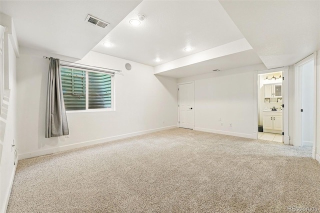1063 Roslyn Ct, Denver, CO 80230 - unfurnished room featuring baseboards, light carpet, recessed lighting, and a sink