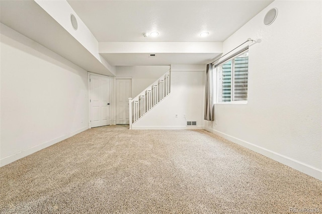 1063 Roslyn Ct, Denver, CO 80230 - unfurnished living room with baseboards, stairs, and carpet flooring