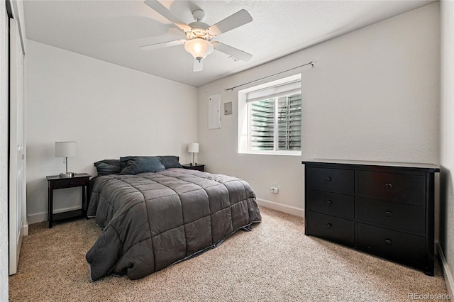 1063 Roslyn Ct, Denver, CO 80230 - bedroom featuring light colored carpet, baseboards, and ceiling fan