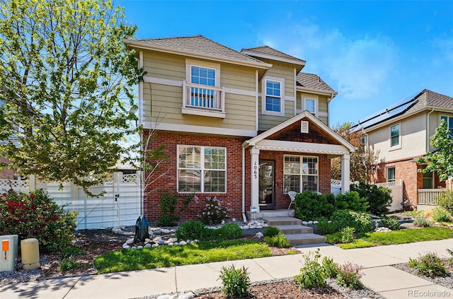 1063 Roslyn Ct, Denver, CO 80230 - view of front of home with fence and brick siding