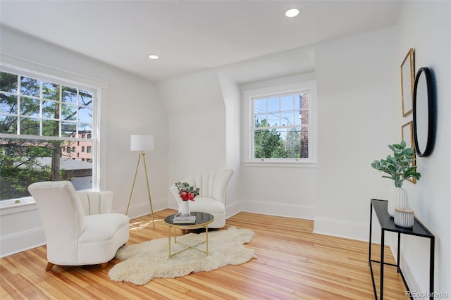 sitting room with wood finished floors, baseboards, and recessed lighting