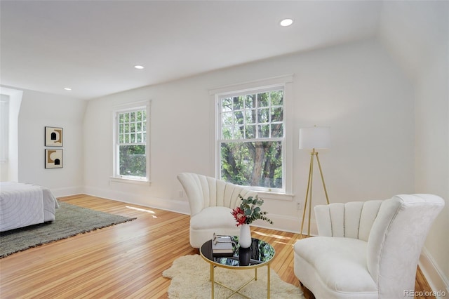bedroom featuring wood finished floors, recessed lighting, and baseboards