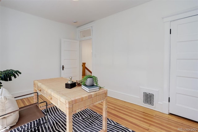 home office featuring light wood finished floors and baseboards