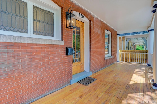 wooden terrace featuring a porch