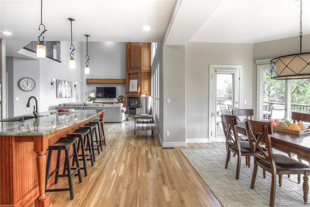 dining room with baseboards and light wood-style floors