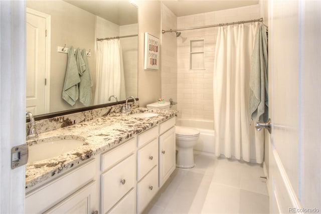 bathroom featuring shower / bath combo, tile patterned floors, a sink, and double vanity