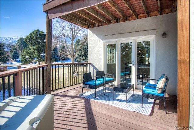 wooden deck featuring an outdoor hangout area