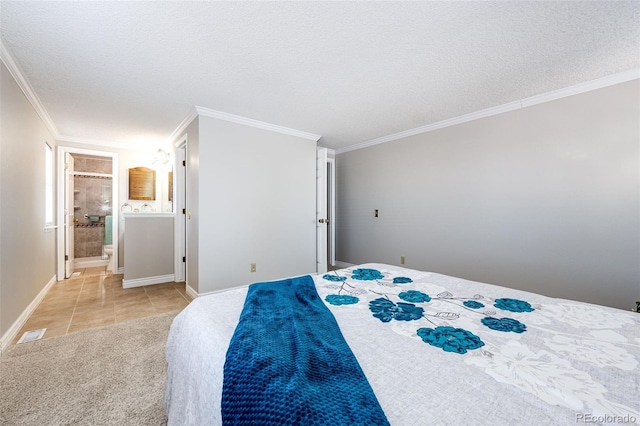 bedroom with ensuite bathroom, crown molding, light tile patterned floors, and a textured ceiling