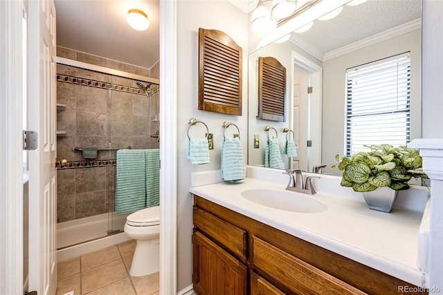 bathroom with tile patterned floors, crown molding, an enclosed shower, toilet, and vanity