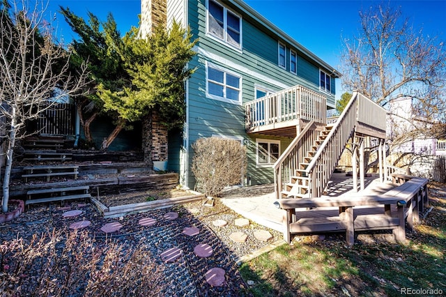 rear view of house with a wooden deck