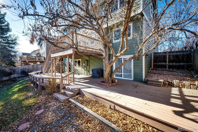 back of property featuring a wooden deck