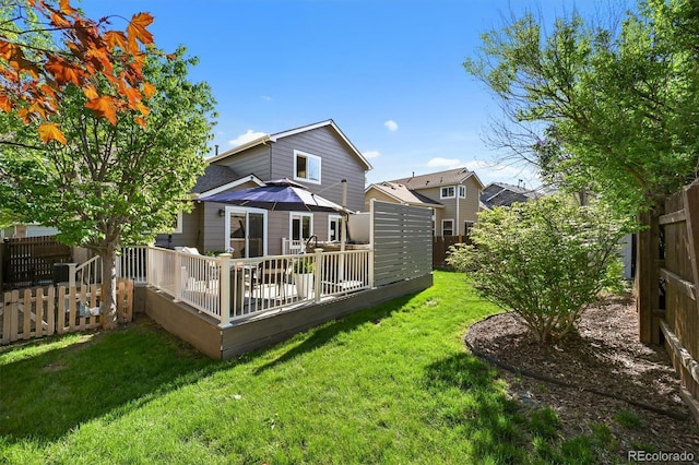 rear view of house with a deck