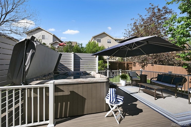 wooden terrace featuring fence and an outdoor hangout area