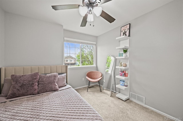 carpeted bedroom with baseboards and a ceiling fan