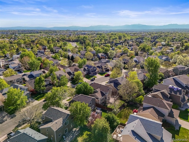 aerial view of residential area featuring mountains