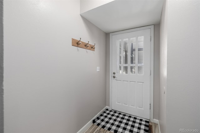 doorway with wood-type flooring