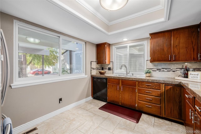 kitchen with dishwasher, a tray ceiling, backsplash, sink, and crown molding