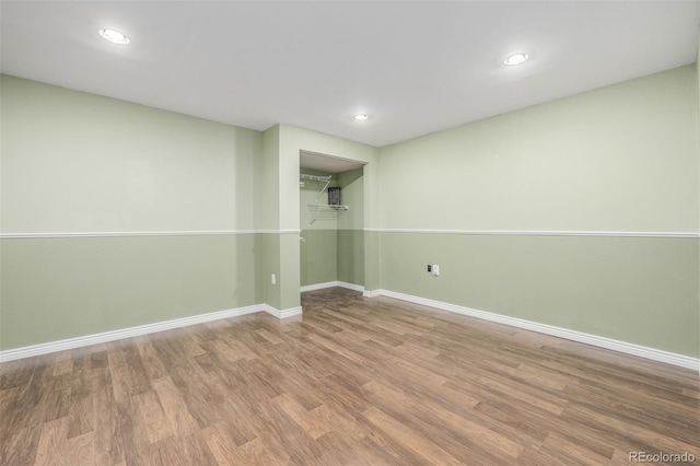 basement featuring wood-type flooring