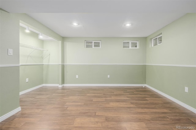 basement featuring hardwood / wood-style floors