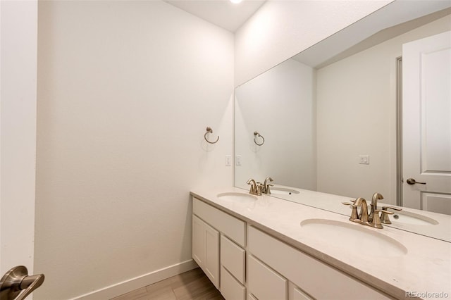 bathroom featuring hardwood / wood-style floors and vanity