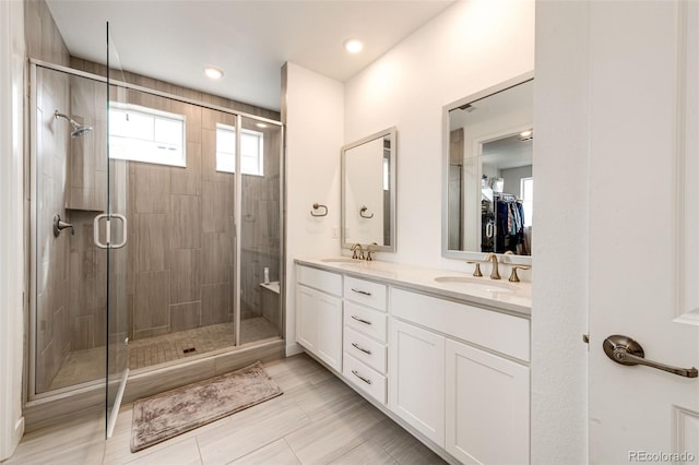 bathroom with vanity, tile patterned floors, and a shower with shower door