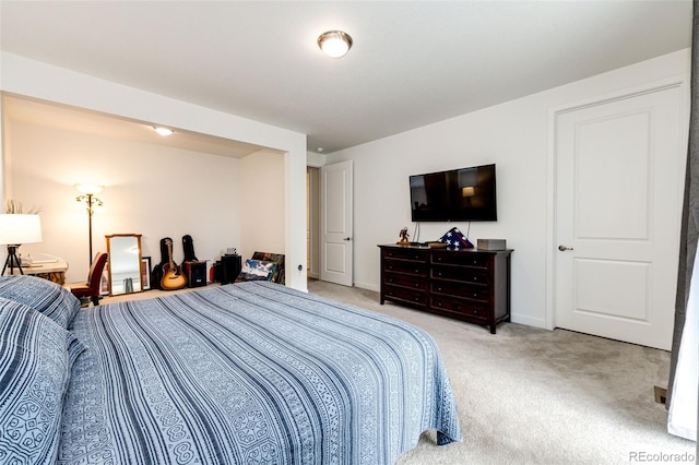 bedroom with light colored carpet