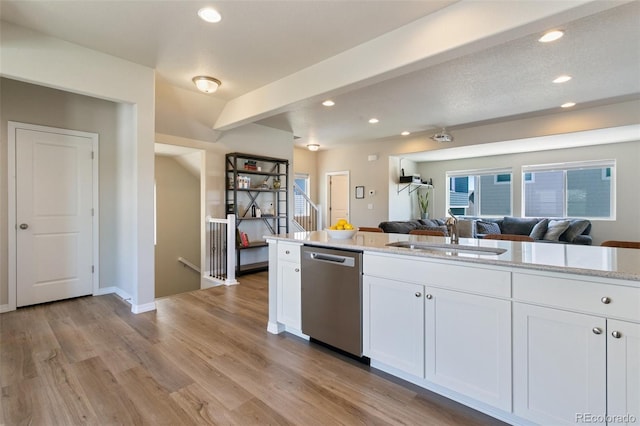 7407 Rufous Fronted Vw, Colorado Springs, CO 80923 - kitchen featuring dishwasher, recessed lighting, light wood finished floors, white cabinetry, and open floor plan
