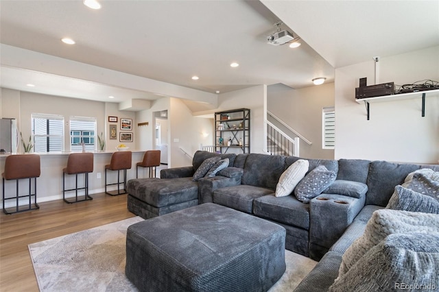 7407 Rufous Fronted Vw, Colorado Springs, CO 80923 - living room with light wood-style floors, stairs, and recessed lighting