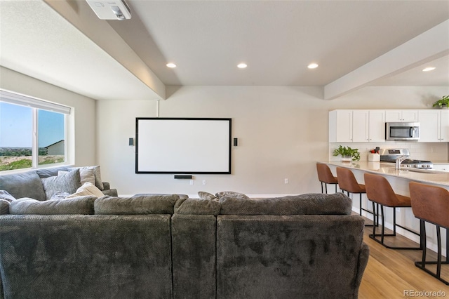 7407 Rufous Fronted Vw, Colorado Springs, CO 80923 - cinema room with light wood-style flooring, recessed lighting, and beam ceiling