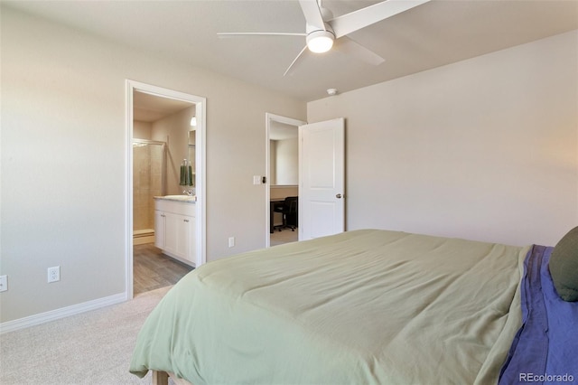 7407 Rufous Fronted Vw, Colorado Springs, CO 80923 - bedroom with light colored carpet, connected bathroom, and a ceiling fan