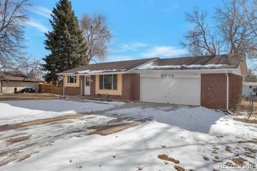 ranch-style home with a garage