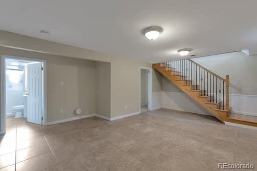 unfurnished living room with light tile patterned floors