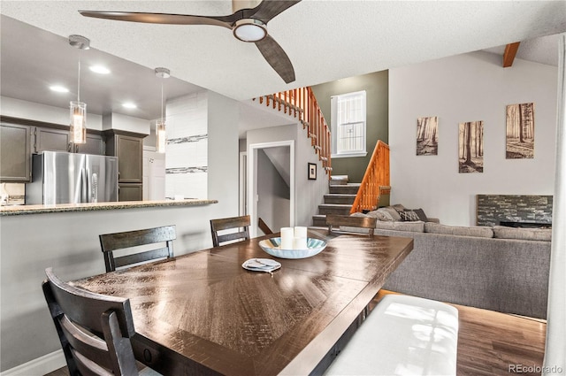 943 S Fairplay St, Aurora, CO 80012 - dining area with ceiling fan, stairway, recessed lighting, wood finished floors, and vaulted ceiling
