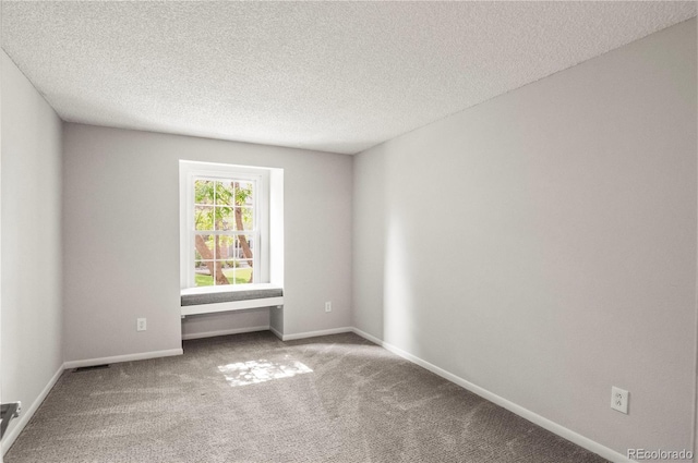943 S Fairplay St, Aurora, CO 80012 - carpeted empty room featuring a textured ceiling and baseboards