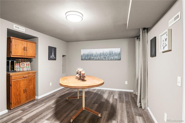 943 S Fairplay St, Aurora, CO 80012 - dining area with dark wood-style floors and baseboards
