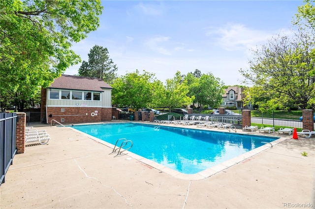 943 S Fairplay St, Aurora, CO 80012 - community pool featuring a patio area