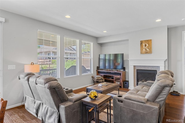 15895 Columbine St, Thornton, CO 80602 - living room featuring a glass covered fireplace, dark wood finished floors, and recessed lighting