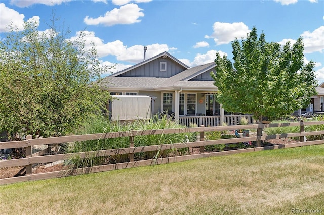15895 Columbine St, Thornton, CO 80602 - view of front of home featuring board and batten siding and covered porch