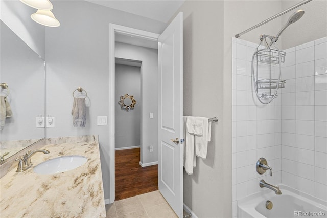 15895 Columbine St, Thornton, CO 80602 - bathroom with bathtub / shower combination, vanity, and tile patterned floors
