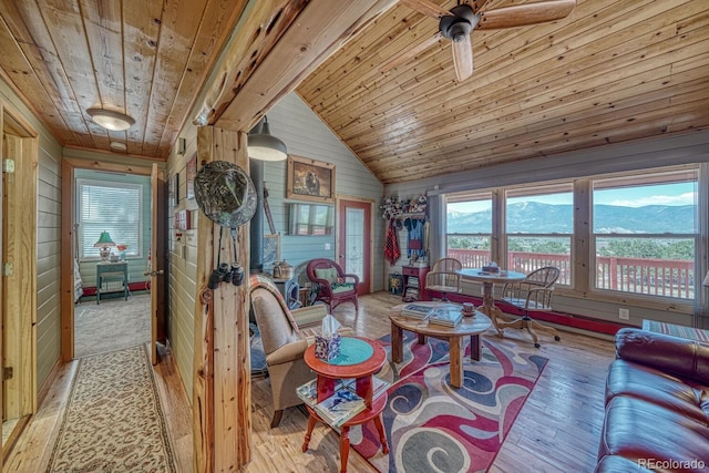10199 W Cheyenne Cir, Salida, CO 81201 - living area with wooden ceiling, wooden walls, light wood-type flooring, a ceiling fan, and lofted ceiling
