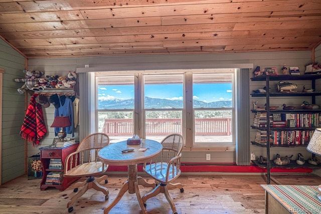 10199 W Cheyenne Cir, Salida, CO 81201 - dining space featuring vaulted ceiling, wood ceiling, hardwood / wood-style floors, plenty of natural light, and a mountain view